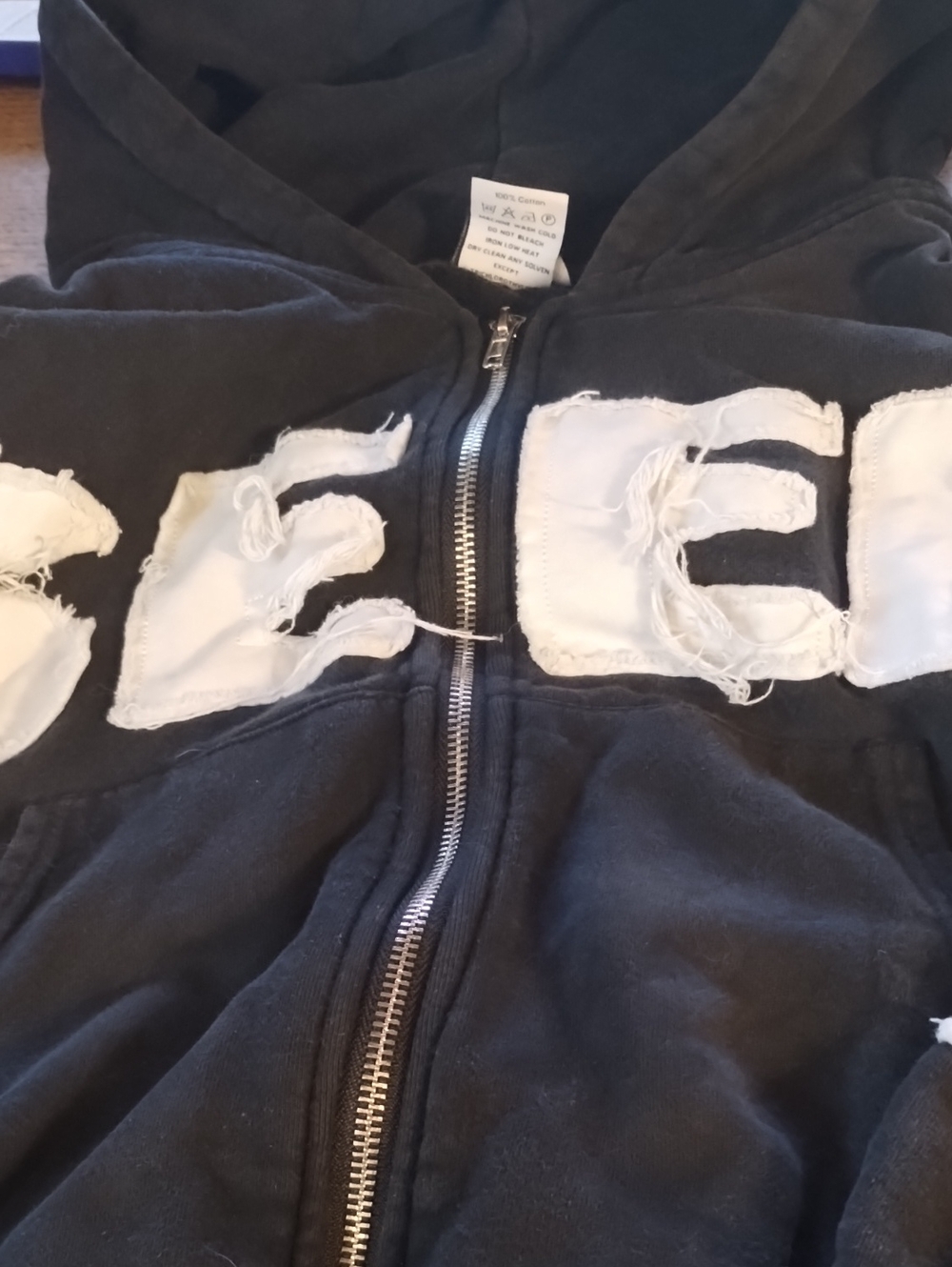 Black Zip-Up Hoodie with White Distressed Lettering